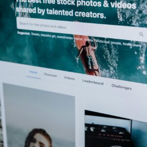 Close-up of a computer screen showing a stock photo website interface with multiple images.